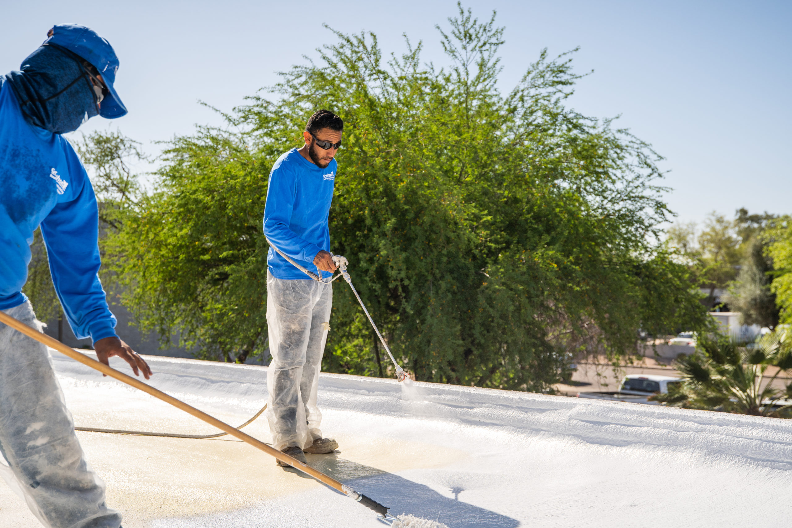 Man Spraying Elastomeric Roof Coating