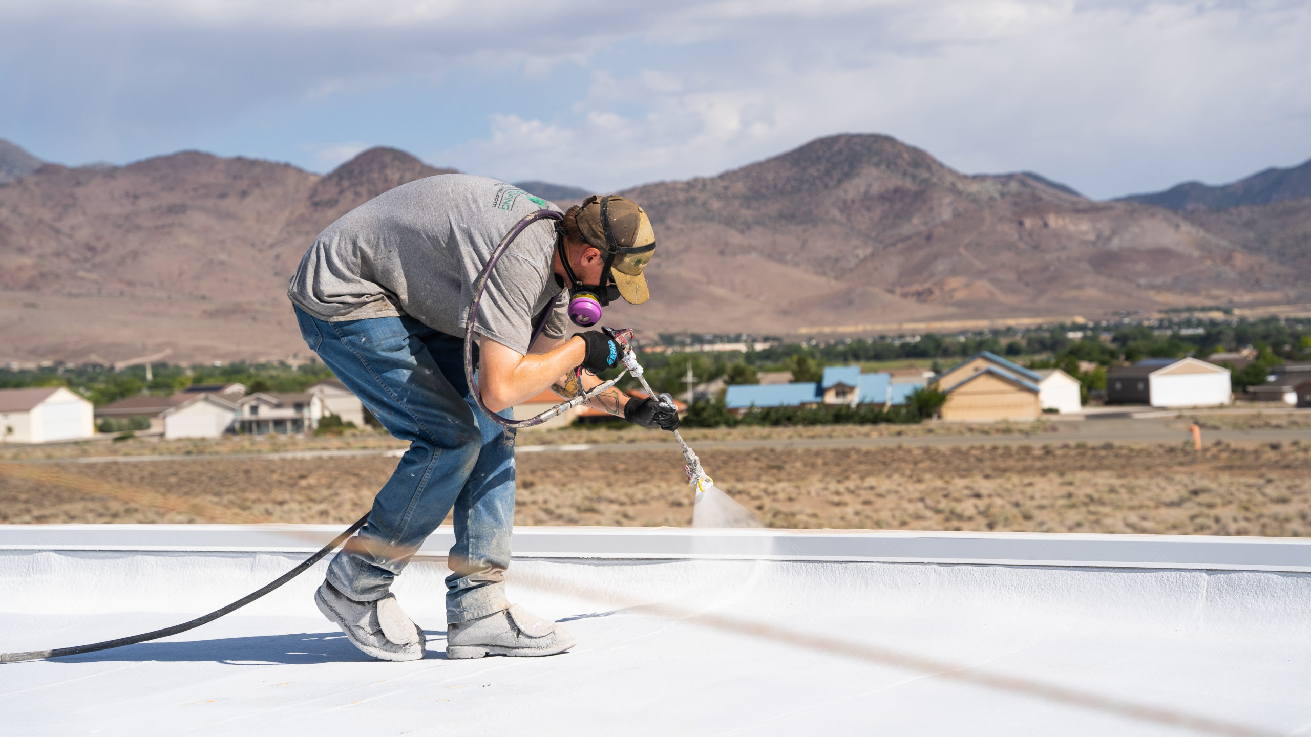 Roof coating being applied