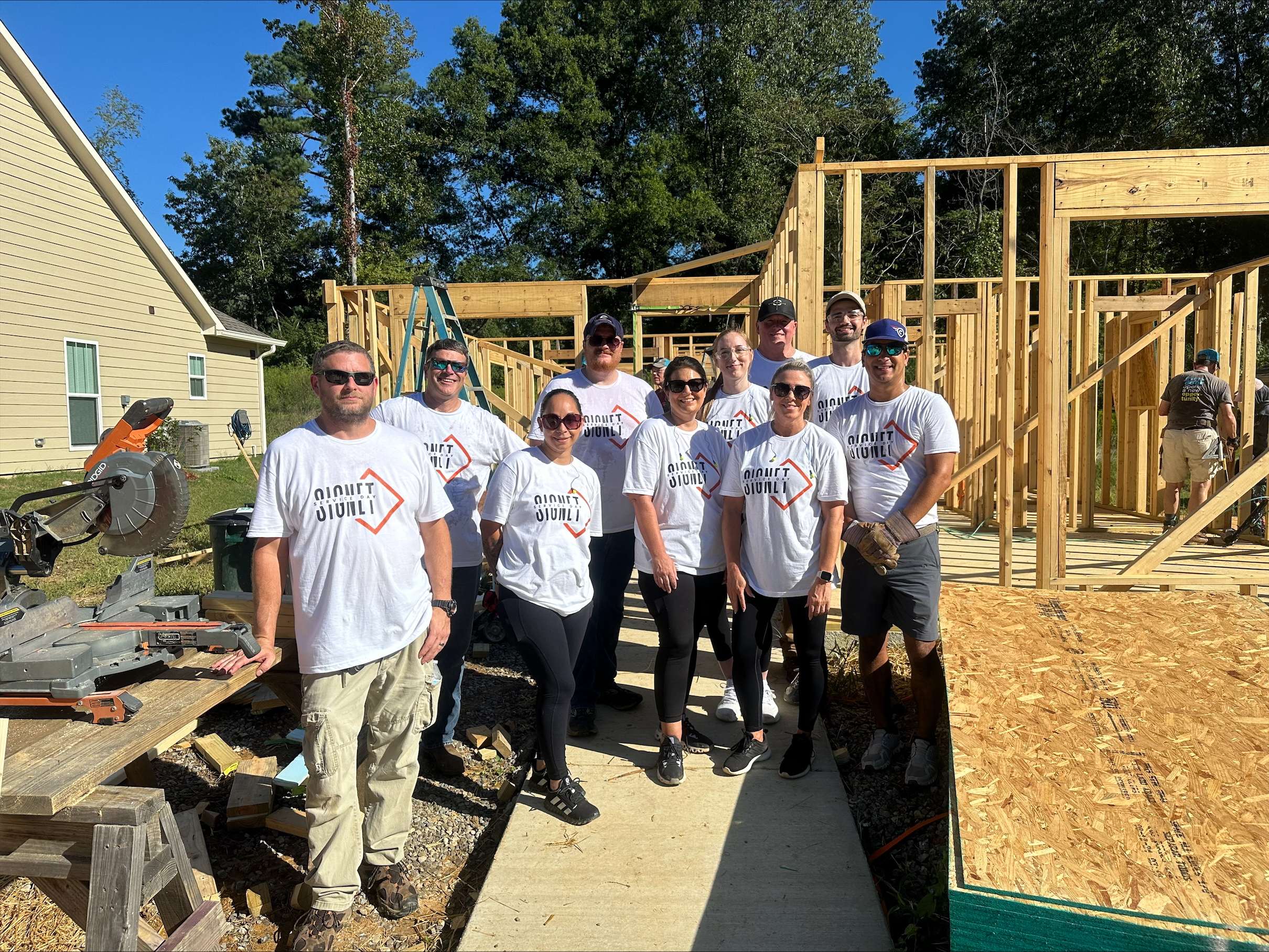 Members of the Rugged Coatings team working hard with Habitat for Humanity